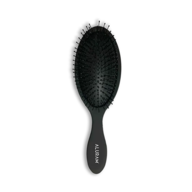 Aluram Detangle Brush gently removing knots without breakage
